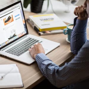 Employee intently working on a project using their laptop