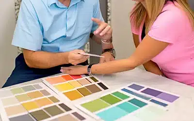 Professional painter consulting with homeowner about paint color choices