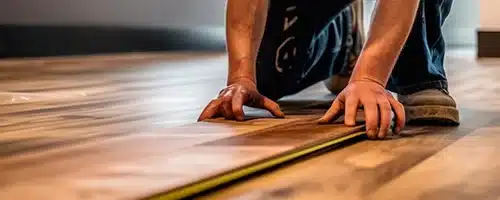 Expert contractor meticulously installing hardwood flooring