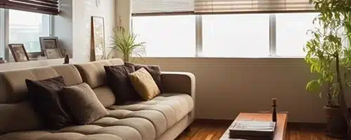 Sunlit living room with window coverings to protect hardwood floors from sunlight