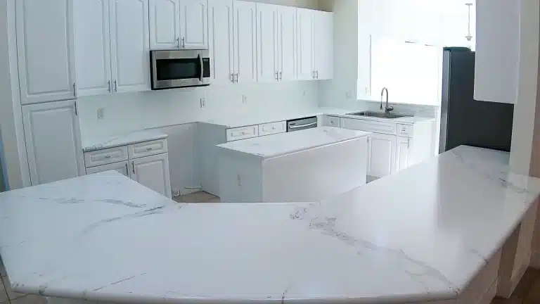 A modern kitchen with a glossy, high-quality epoxy countertop installed by Value Painting and Flooring