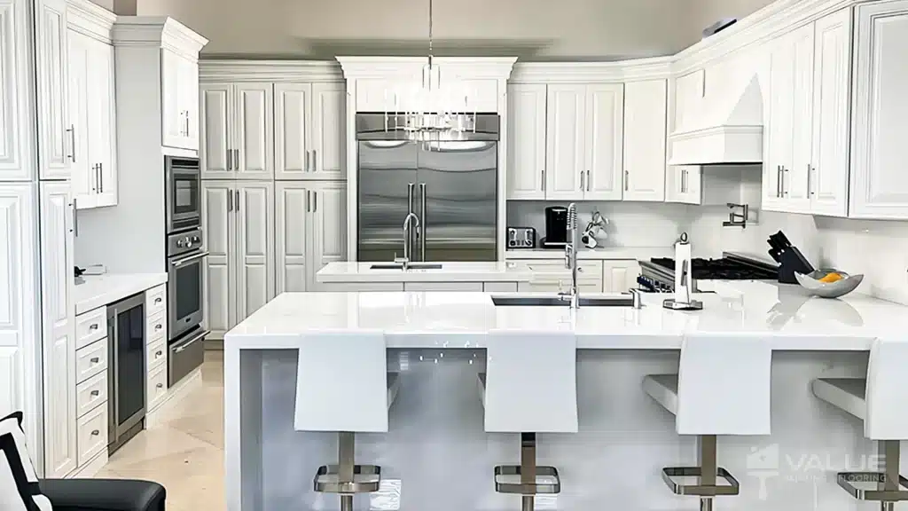 A bright and fresh white kitchen cabinet, transformed by Value Painting and Flooring's professional cabinet painting services.
