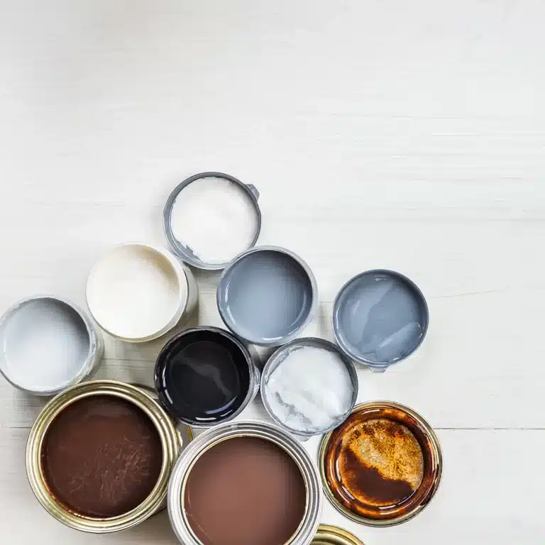 Different types of stains and varnish paints used for staining and varnishing services.