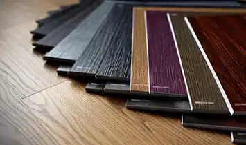 Different luxury vinyl flooring samples with price tags