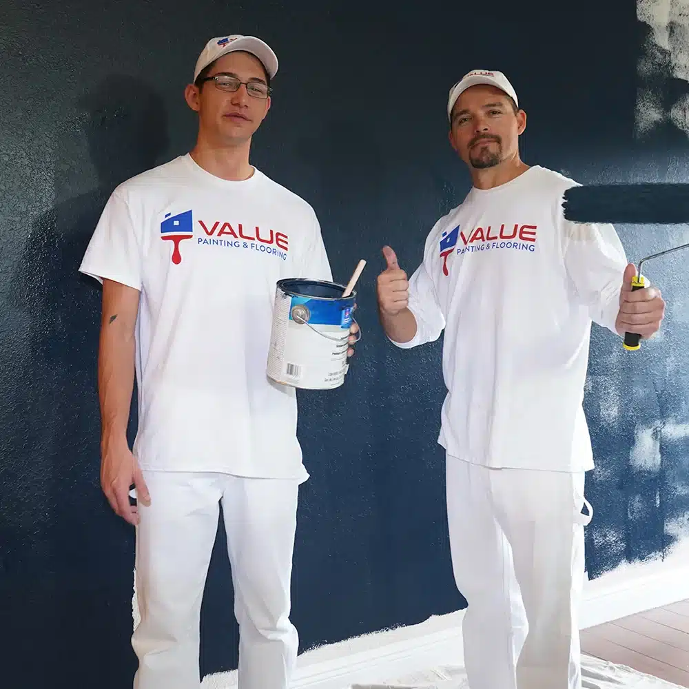 Value Painting and Flooring team posing with Sherwin Williams ProMar eco-friendly paint.