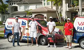 Value Painting and Flooring team in front of South Florida home
