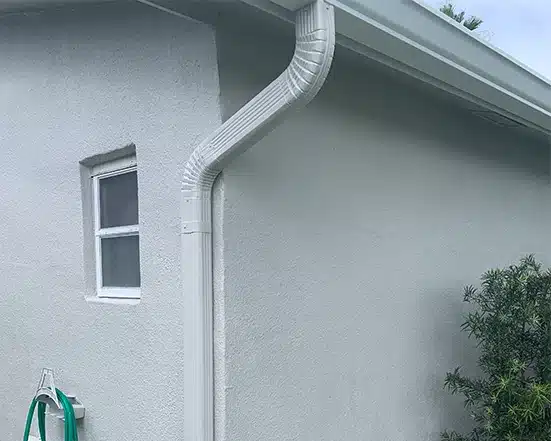 Pristine gutter and downspout painting on a residential home
