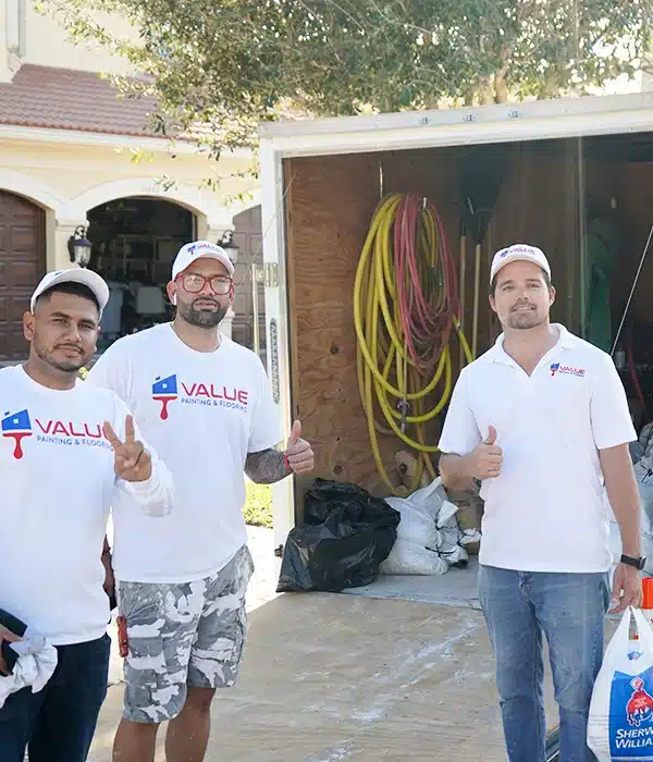 Happy Value Painting and Flooring employees with thumbs up